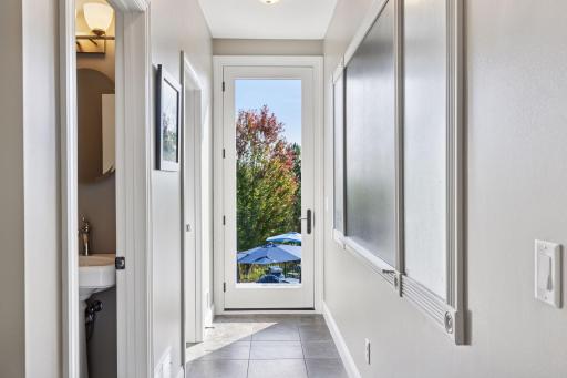 The mudroom leads to the a half bath, walk-in closet and large magnetic and chalk board - a perfect spot for all your schedule organization needs.