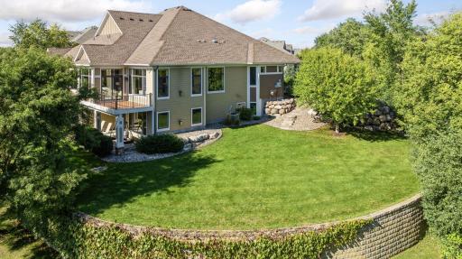 The private land to this property is adjacent to trees and the golf course.