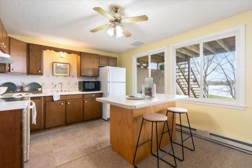 Kitchen in the lower level with walk-out to lakeside patio