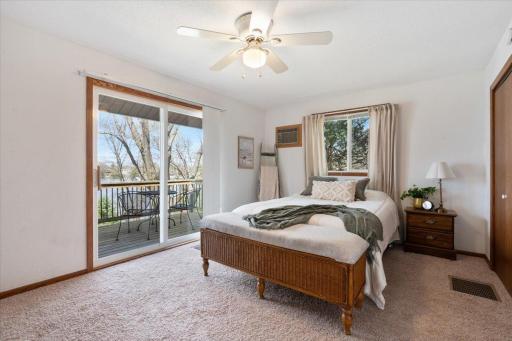 Primary LAKE SIDE bedroom with deck access