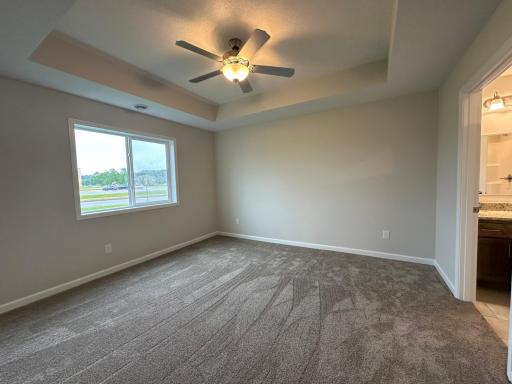 Primary bedroom with box vaulted ceiling