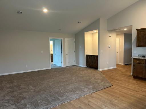 Living room with built-in dry bar and storage closet