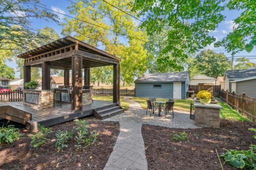 Your oasis awaits! You'll want to see this amazing backyard complete with an outdoor kitchen, fireplace, fire pit and space for potting plants.