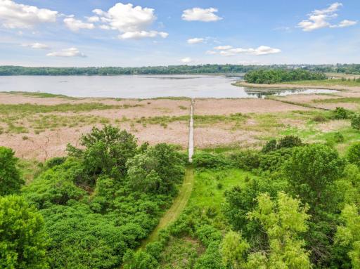 Scenic walking trail down to your escape to the lake, you can even fish right off the dock.