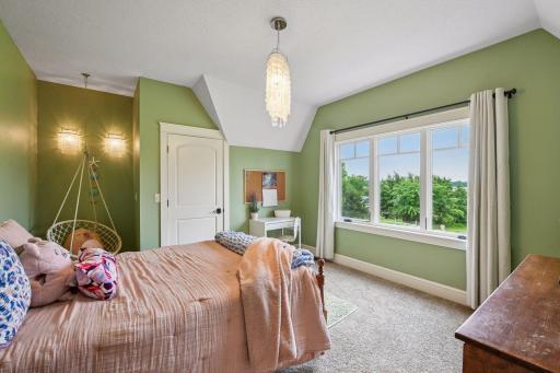 Another spacious bedroom in the upper level with reading nook.
