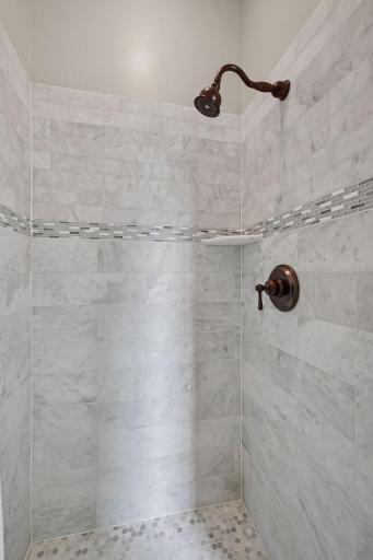 3/4 ensuite bathroom shower with marble surround.