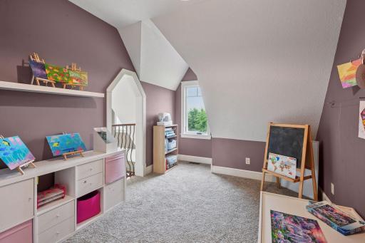 The princess balcony loft that overlooks the main living/family room. Currently used as an art space.