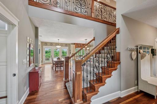 Stunning millwork and intricate wrought iron stairway.