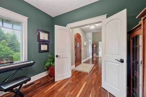 This room overlooks the tree lined front yard.