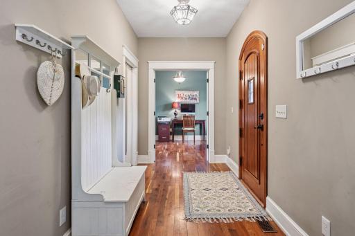 Front foyer with plenty of space. The amazing walnut floors continue. Freshly painted in 2025