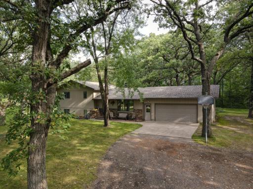 The one you've been waiting for! 5 wooded acres, a huge outbuilding, and a great home!