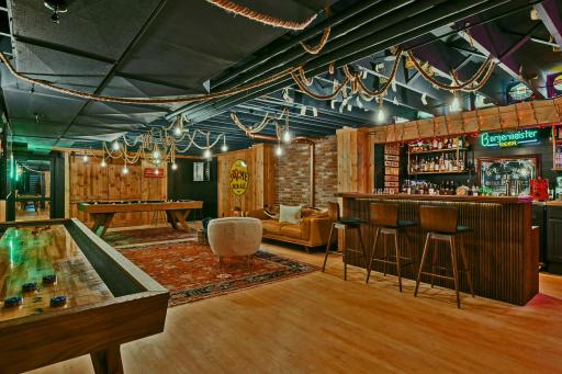 Speakeasy / pub with full wet bar. This space can be easily transformed to a more traditional lower family / amusement room. 20025 Manor Road - Spacecrafting - 0077 e1.jpg