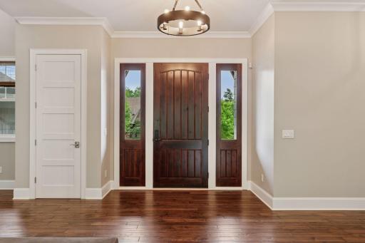 Step inside to a light-filled foyer that sets the tone - warm, welcoming, and effortlessly elegant.