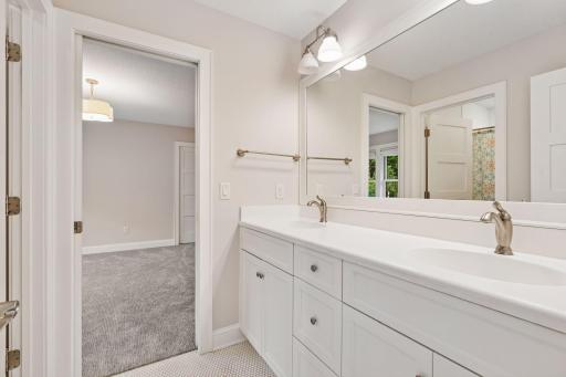 Smart design meets daily convenience with connected Jack-and-Jill baths between each bedroom pair.
