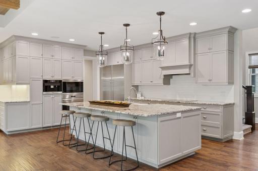 The expansive island offers a natural place to uncork a bottle of wine, set out a charcuterie board, or linger over Saturday morning pancakes.