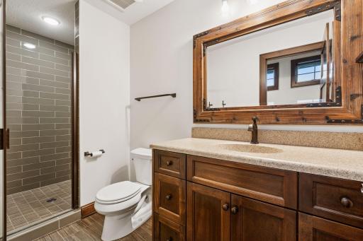 A thoughtfully positioned ensuite bedroom with generous space and a connected private bath.