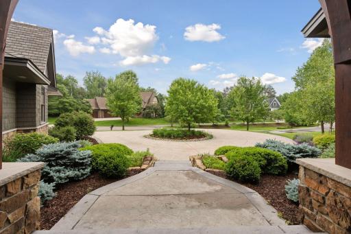 Thoughtfully designed for function and flow, the circular drive plenty of guest parking.