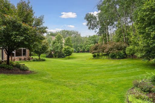 Tucked into a wooded lot this home offers a peaceful retreat just steps from Lake Elmo Park Reserve.