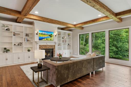 Custom built-in bookshelves and cabinets provide elegant, purposeful storage and display.