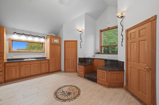 Primary bathroom, his & her walk in closets