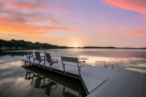 A large dock with built-in seating adds to the lakeside enjoyment. Imagine enjoying sunsets in this beautiful, serene location!