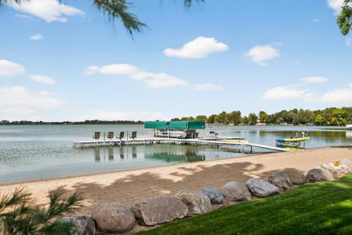 The 135 feet of private sandy lakefront invites swimming, boating, and relaxation.