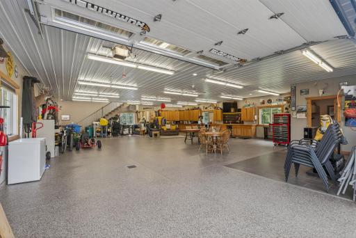 A custom 2,700-square-foot workshop offers abundant storage for vehicles, tools, or toys on the main level.