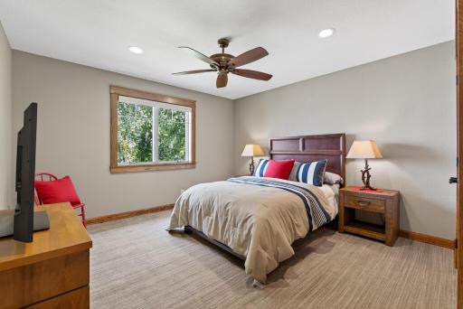 Each bedroom offers plush carpeting and ceiling fans for added comfort.