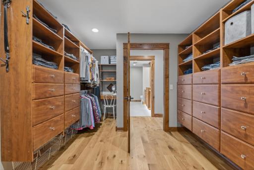 A 17-by-11-foot walk-in closet with built-in organization offers abundant storage.