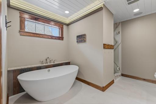Features include a soaking tub and dual vanities.