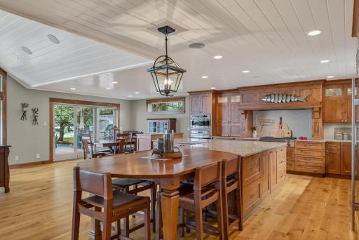 Ample custom cabinetry with roll-out drawers provides convenience.