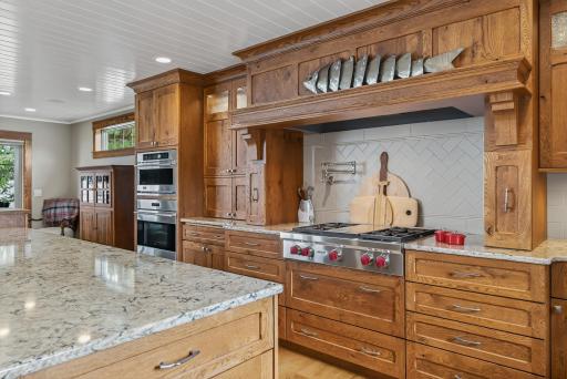 Enjoy high-end Sub-Zero and Wolf appliances, double ovens, a pot filler, and a spacious walk-in pantry.