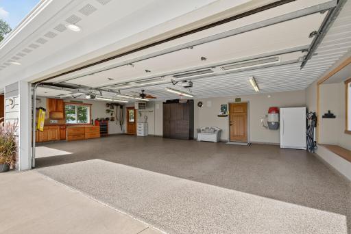 The attached, heated 3-car garage offers plenty of space for vehicles and built-in storage solutions.