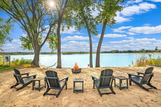 Paradise found: your private sandy beach, firelit evenings, and shimmering blue waters.