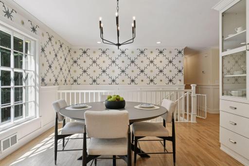 custom wall paper and new light fixtures add sense of whimsy and sophistication throughout the home