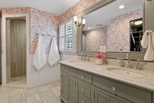 Recently updated primary bath offers heated floors and a walk in closet