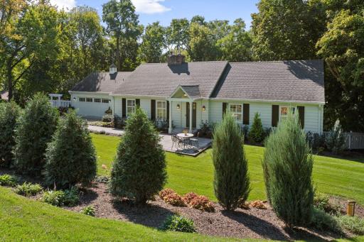 Perfectly nestled on a large corner lot with fabulous new landscaping features