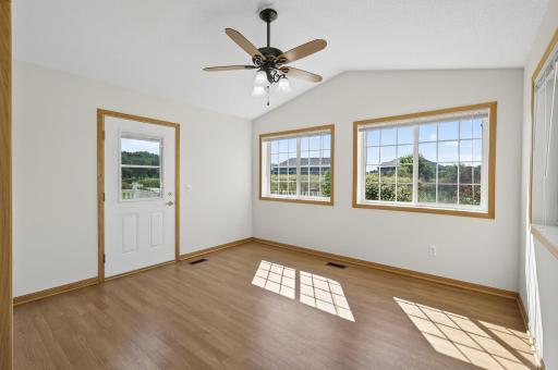 View of light and airy sunroom perfect for enjoying all season!