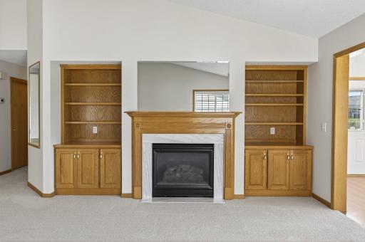 Gas fireplace with natural woodwork shelving