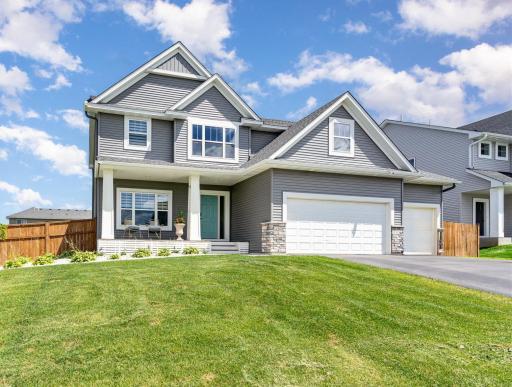 Beautiful curb appeal on this spacious "Eastridge" 2 story floorplan which has the 4th bedroom above the garage which makes all the upstairs bedrooms larger. The sellers replaced the wood porch and added trex maintenance free decking and lattice.