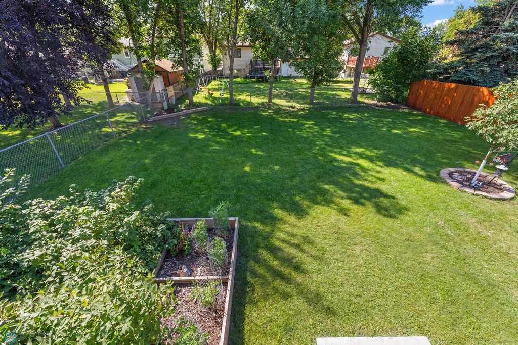 Backyard view 2, treed w/garden
