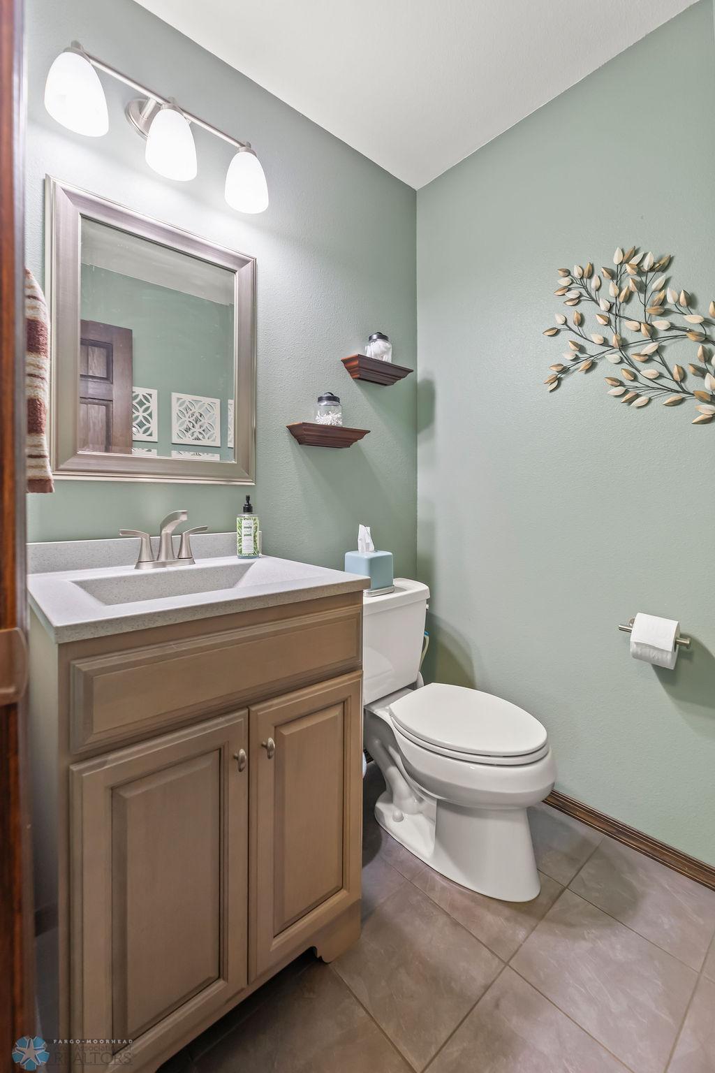 Upper half bath, tile floors