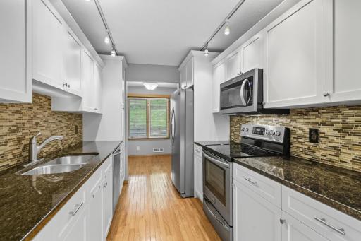 Enjoy your updated kitchen with newer cabinets< featuring lower level and pantry pull-out shelves.