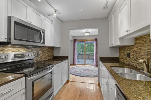 Step outside your dining area onto your huge and stylish deck to enjoy the woods and amazing outdoors.