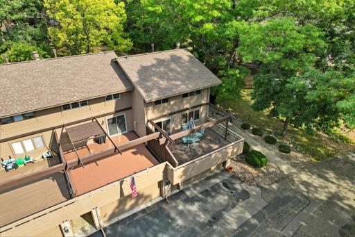 Amazing privacy in this end unit with mature trees and flower gardens