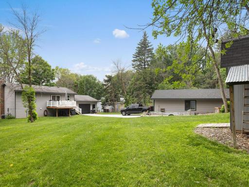 Large back yard and drive way from primary garage to 2nd garage/shop.