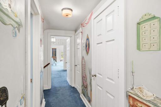 Part of the front hall has the original hand painted wallpaper