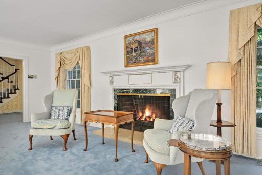 A handsome wood-burning fireplace mantel with a marble surround