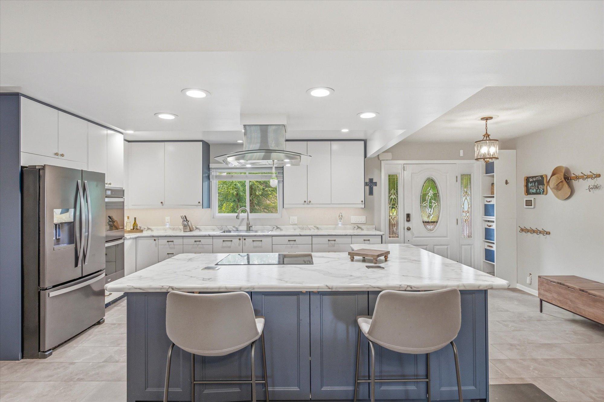 The expansive island offers the perfect gathering place for everyday living and entertaining.