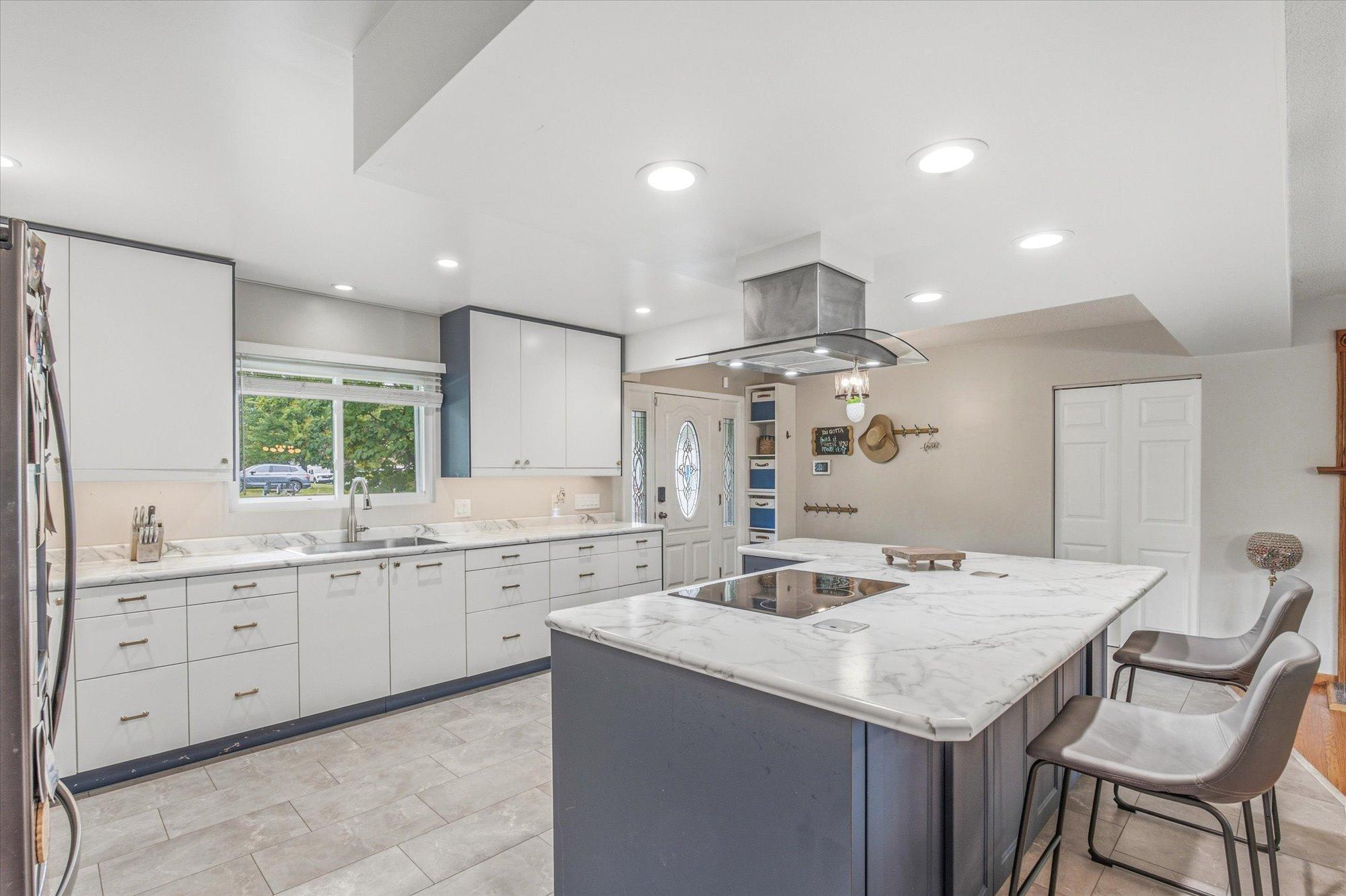 Thoughtfully designed with abundant cabinetry, quartz countertops, and an open layout.